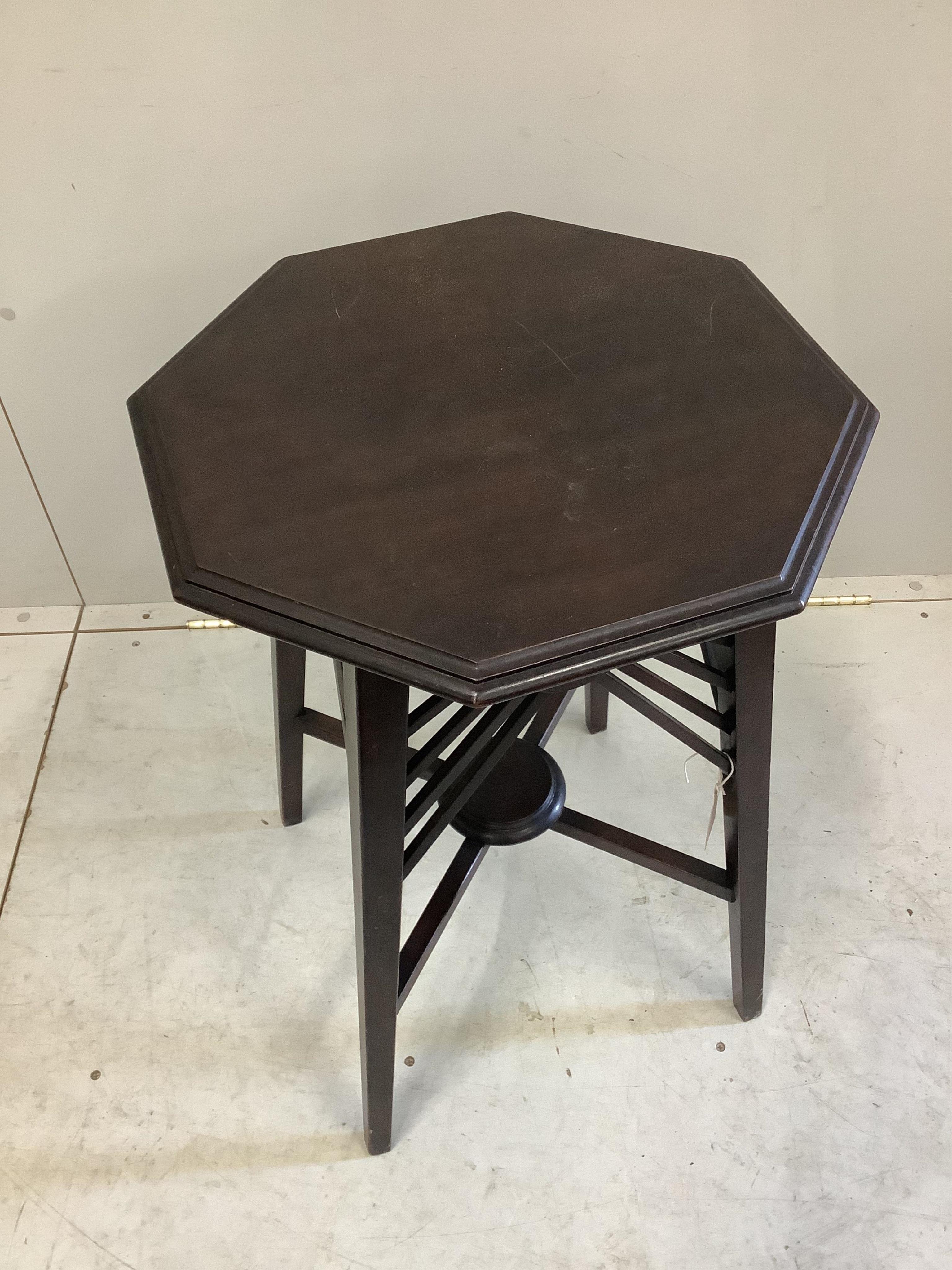 In the manner of Godwin, a late Victorian octagonal mahogany occasional table, width 45cm, height 69cm. Condition - fair to good